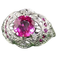 Beautiful Antique Art Deco Platinum Burma Pink Sapphire and Diamond Filigree Engagement Ring - GIA. This gorgeous engagement ring is crafted in platinum. The center holds a natural pink sapphire with a GIA report. It is set in a beautiful Art Deco filigree mounting with old cut pink sapphires and diamonds. The ring is in great condition with crisp engravings going around the ring as well. The center pink sapphire has a beautiful bubble gum color and really pops! Item #R1782 Metal: Platinum Weight: 6.9 Grams Size: 7 1/2 Sapphire: 2.67 ct - Burma NO HEAT - GIA # 6223981058 Diamonds: Approximately .20 cts Color: H Clarity: VS2 Side Pink Sapphires: Approximately .10 cts Measurements: Top of the ring measures 15.66 mm wide and band measures 2 mm wide. Measurements off the finger: 7.55 mm high L Art Deco Filigree, Filigree Engagement Ring, Gorgeous Engagement Ring, Antique Art Deco, Jewelry Rings Engagement, Antique Art, Pink Sapphire, Bubble Gum, Beautiful Art