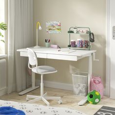 a child's desk and chair in the corner of a room with white walls