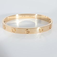 This is part of Chairish’s Fine Jewelry assortment.  Cartier Love Bracelet in 18k Yellow Gold   PRIMARY DETAILS   SKU: 137274   Listing Title: Cartier Love Bracelet in 18k Yellow Gold   Condition Description: Cartier's Love collection is the epitome of iconic, from the recognizable designs to the history behind the line-up. The collection started in 1969 with the bangle bracelet, which is engraved with a circular motif throughout to mimic the look of the bracelet's signature screw-lock mechanism.       Retails for 7350 USD. In excellent condition and recently polished. 16 cm in length. Comes with Box;Certificate of Authenticity;Screwdriver;   Brand: Cartier   Collection/Series: Love   Metal Type: Yellow Gold   Metal Purity: 18k   Chain or Bracelet Length (in): 16   Pre-Owned Jewelry Condit Gold Cartier Bracelet, Cartier Love Collection, Cartier Collection, Cartier Bracelet, Grown Women, Love Bracelet, Cartier Love, Cartier Love Bracelet, Love Bracelets