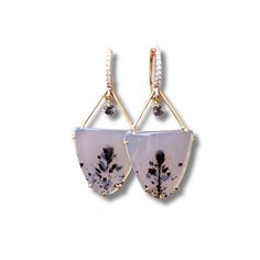 Handcrafted in 14K yellow gold and adorned with sparkling diamonds, these one-of-a-kind earrings showcase a mesmerizing pair of Montana Agates. These rare agates feature a preserved flower, frozen in time, while a grey spinel charm hangs delicately, adding a touch of movement and shimmer. Enclosing a timeless bloom, these earrings represent everlasting beauty and love. Elegant Dangle Earrings With Natural Inclusions, Elegant Agate Jewelry With Gemstone Accents, Elegant Chalcedony Drop Earrings, Elegant Chalcedony Jewelry With Gemstone Accents, Elegant Chalcedony Earrings With Natural Stones, Montana Agate, Frozen In Time, How To Preserve Flowers, Sparkle Diamonds