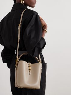 SAINT LAURENT's iconic 'YSL' hardware can even double as a clasp. A feature on this small 'Le 37' bucket bag, the brushed gold-tone metal stands out beautifully against the smooth leather, while the coordinating feet deter wear and tear. Stash your phone, keys and cardholder inside, using the detachable strap to sling it over your shoulder. Small Bucket Bag, Small Buckets, High Fashion Looks, Raffia Bag, Woman Style, Ballet Pumps, Leather Bucket Bag, Leather Bucket, Mini Bags