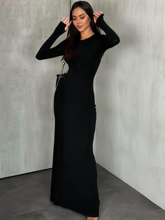 Awe and inspire with this classic black maxi dress, a symbol of elegance with its form-fitting design and full sleeves. Crafted from a smooth, luxurious fabric, this dress is a staple for any formal occasion. The simplicity of its cut is its true charm, allowing the wearer to showcase their personal style through elegant accessories. The comfortable stretch material ensures you can move with ease, making it perfect for both daytime sophistication and evening glamour. Seasons: All Season Type: Fi Elegant Long Sleeve Stretch Maxi Dress, Fitted Long Sleeve Floor-length Dress For Night Out, Stretch Maxi Length Long Sleeve Dress For Evening, Stretch Long Sleeve Maxi Dress For Evening, Stretch Long Sleeve Dress For Evening, Elegant Long Sleeve Floor-length Dress For Night Out, Elegant Fitted Floor-length Long Sleeve Dress, Stretch Long Sleeve Maxi Dress For Dinner, Formal Fitted Long Sleeve Dress