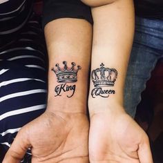 two people with matching tattoos on their arms, one has a crown and the other has a queen