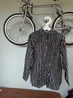 This is a preppy vintage shirt from Finnish company Marimekko. Classic style Jokapoika shirt. vintage from 1970s. Black&White stripes. Very nice design, pocket and classic metal buttons in the front.  Nice crispy cotton fabric. Marked as size Medium. Unisex.  chest is 114cm by armpit. Good condition. Don't hesitate to ask for more Measurements in CM or inches.  Made in Suomi Finland. ♪♫♬ Retro Black Shirt For Spring, Retro Long Sleeve Shirt With Placket, Vintage Relaxed Fit Shirt For Work, Relaxed Fit Vintage Shirt For Workwear, Vintage Black Workwear Shirt, Retro Black Workwear Shirt, Vintage Black Shirt For Work, Retro Shirt With Spread Collar For Work, Retro Black Shirt For Work