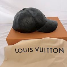 The Monogram Shadow Cap Elevates A Much-Loved Baseball Style To New Heights. Expertly Crafted From 100% Leather And Embossed With A Monogram Shadow Pattern, The Five-Panel Visor Cap Is A Testament To Louis Vuitton's Leatherwork Expertise. This Sleek Accessory Features An Adjustable Back Strap And Matches The Permanent Monogram Shadow Line Of Leather Goods. Designer Adjustable Black Baseball Cap, Designer Black Baseball Cap With Curved Brim, Designer Black Baseball Cap, Designer Black Baseball Cap With Flat Brim, Black Hat With Logo Print And Flat Brim, Designer Black Cap, Luxury Black Adjustable Hats, Luxury Snapback Hat With Logo, Luxury Black Cap