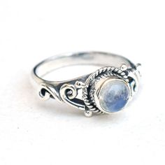 Natural Moonstone Ring, 925 Sterling Silver Moonstone Ring, Handmade Silver gemstone Ring, One of Kind Silver Ring. Product: Ring Metal/Material: 925 Silver Gemstone: Moonstone Stone Type: Cab stone Stone size: 7 mm approx. Stone shape: Round Weight: 4 gram approx. Birthstone: June Ring Sizes: 4  to 12 US. Select on drop down Stone Setting: Bezel Stone Color: White Finishing: Shiny silver            Gemstone Properties: Rainbow moonstone is thought to bring balance, harmony and hope while enhanc Sterling Silver Round Moonstone Ring With Moon Phase, Bohemian Moon Shaped Gemstone Ring, Sterling Silver Moonstone Ring Shaped Like Moon For Promise, Sterling Silver Moonstone Ring In Moon Shape, Sterling Silver Oval Rings With Moon Phase, Sterling Silver Oval Rings With Moon Phase Detail, Sterling Silver Moonstone Ring In Moon Shape For Promise, Moon Shaped Moonstone Ring In Sterling Silver, Moon Shaped Sterling Silver Opal Ring