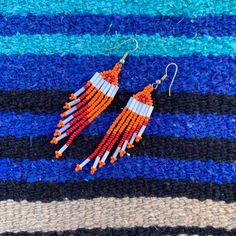 Handmade Long Beaded Dangle Earrings, Orange and Red Fringe Southwestern Earrings Southwestern Beaded Fringe Dangle Earrings, Southwestern Style Beaded Fringe Dangle Earrings, Southwestern Beaded Dangle Earrings, Southwestern Style Beaded Dangle Earrings, Southwestern Beaded Fringe Earrings For Gift, Southwestern Beaded Drop Earrings For Pierced Ears, Southwestern Style Beaded Drop Earrings, Southwestern Beaded Fringe Dangle Jewelry, Southwestern Style Beaded Fringe Dangle Jewelry