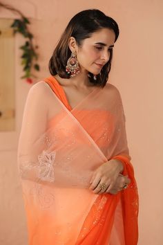 Orange ombre saree with mukaish floral embroidery. Comes along with unstitched blouse piece. - Aza Fashions Eid Sheer Dupatta Georgette Blouse, Eid Georgette Blouse With Sheer Dupatta, Festive Fusion Pre-draped Georgette Saree, Fusion Style Wedding Saree For Diwali, Wedding Fusion Saree For Diwali, Fusion Style Georgette Saree With Dupatta, Fusion Pre-draped Saree With Unstitched Blouse For Diwali, Fusion Style Dupatta With Resham Embroidery For Diwali, Festive Fusion Saree With Sheer Dupatta