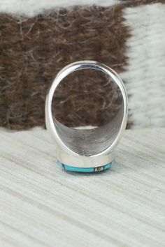 This turquoise and sterling silver inlay ring was made by Zuni silversmith Amy Wesley. The inside is signed Amy.Size: 10Length: 1 1/8"Width: 5/8"Free shipping on all orders! We ship with USPS and always include tracking. All orders ship within a day of payment.Returns are accepted up to 30 days after you receive your order. Just send us a message. Our shop offers cash back or store credit. The item must be returned in the same condition. Artisan Silver Turquoise Ring With Inlay, Silver Turquoise Ring With Inlay, Oval Turquoise Ring With Sterling Silver Inlay, Anniversary Turquoise Inlay Ring In Sterling Silver, Native American Jewelry, Turquoise Sterling Silver, Free Jewelry, Silver Rings, Size 10