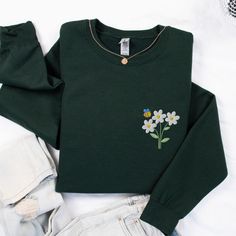 This unisex Gildan cozy Spring embroidered daisies sweatshirt is trendy, comfortable and versatile and perfect to wear for a variety of looks - classic and cozy or oversized with the sleeves rolled up for a trendy, casual look!  It's going to be your new closet favorite and an item that you always seem to reach for!  It makes a great April birth month flower birthday gift, a cute spring sweatshirt, or a gift for grandma, or a plant mom. * 50% cotton, 50% polyester * Pre-shrunk * Classic fit * 1x Kawaii Bee, Daisy Sweatshirt, Embroidered Daisies, Spring Sweatshirt, Flower Birthday, Spring Sweater, Cute Spring, Plant Mom, Birth Month