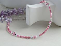 "If you like pink, you will love this pink crystal anklet!  This pink crystal anklet is made up of hot pink seed beads, sterling silver round beads and preciosa pink crystals and  clear crystals.  Anklet measures about 9 1/4\" and has an adjustable 1\" sterling silver extension chain giving you up to 10 1/4\" if needed. It is finished with a sterling silver trigger clasp that is easy to open and close.  The extension chain has a crystal hanging from the end.  ~HOW TO MEASURE YOUR ANKLE FOR A GOO Pink Anklet, Anklet For Women, Crystal Hanging, Crystal Anklet, Beach Anklets, Beaded Anklets, Women Pink, Bracelet Ideas, Ankle Bracelet