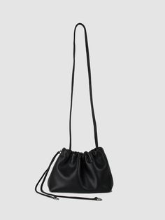 A soft drawstring pouch inspired by Leighton our Creative Marketing Manager. Adjustable and removable leather strap for hand/shoulder/crossbody wear. Option to add any of the chain straps for an added versatility. Made with our soft black leather, unlined. Made in Canada. 9” x 6” x 4” 44" long strap. Versatile Evening Satchel, Versatile Leather Shoulder Bag With Detachable Strap, Modern Pouch Satchel With Adjustable Strap, Modern Satchel With Adjustable Strap In Pouch Shape, Versatile Evening Bag With Adjustable Handle, Black Leather Pouch For Daily Use, Black Leather Pouch For On-the-go, Versatile Everyday Textured Leather Bucket Bag, On-the-go Soft Leather Crossbody Shoulder Bag