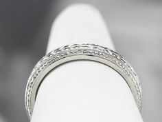 A beautiful platinum band for wearing as a wedding ring, this would make a great stacking ring, as well! The pattern is pretty, what we call a wheat pattern, and is classic for the era. Metal: Platinum Width of Band: 3.8 mm Height off Finger: 2.1 mm Ring Size: 6.50 Marks: "90% PLAT CTI" Stamped on the inside band White Gold Heirloom Stackable Rings, Heirloom White Gold Stackable Diamond Ring, Timeless Stackable Engraved Wedding Ring, Timeless Stackable Rings With Decorative Band, Classic Stackable Ring Bands, Classic Engraved Stackable Ring, Heirloom Diamond Ring With Decorative Band, Round Cut, Classic Stackable Rings With Decorative Band For Promise, Classic Stackable Sterling Silver Bands