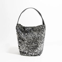 Elevate Your Style with Luxury Sparkling Sling Hobo Evening Purse Get ready to dazzle and shine with our Luxury Sparkling Sequin Ladies Sling Hobo Evening Purse! This exquisite handbag is a true fashion statement, designed to make you stand out in any crowd. With its glittering sequin exterior and big fashion bucket shopper tote design, it's the perfect accessory for trendsetters. Key Features: Versatile Occasion: This purse is perfect for a wide range of occasions, from glamorous evening parties to casual outings with friends. Interior Organization: It features a convenient cell phone pocket and interior zipper pocket to keep your essentials organized and easily accessible. Soft and Stylish: The soft construction of this hobo purse makes it comfortable to carry, while the sequined decorat Glamorous Bucket Evening Bag, Chic Bucket Evening Bag For Party, Elegant Silver Bucket Bag For Party, Chic Sequined Shoulder Bag For Party, Glamorous Evening Bucket Bag, Chic Party Bucket Evening Bag, Silver Rectangular Bucket Bag For Party, Chic Metallic Shoulder Bag For Party, Summer Party Shoulder Bag With Adjustable Strap