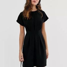 Asos Design Nipped-In Waist Midi Dress In Black. New With Tags! 96% Polyester, 4% Elastane Original Asos Listing: Https://Www.Asos.Com/Us/Asos-Design/Asos-Design-Nipped-In-Waist-Mini-Dress-In-Black/Prd/202856239?Ctaref=More+Colours+Swatches&Featureref1=More+Colours+Swatches Black Short Sleeve Mini Dress For Office, Black Mini Dress With Short Sleeves For Office, Black Mini Dress For Office In Summer, Black Short Sleeve Office Dress, Black Pleated Mini Dress With Short Sleeves, Black Pleated Mini Dress For Work, Black Shift Dresses For Work, Shift Mini Dress For Work, Solid Shift Mini Dress For Work