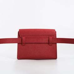 Created with the same compulsive obsession for quality and organizing genius, this belt bag can be a fun companion. Materials: genuine leather & premium waterproof polyester lining Wear it 5-ways – like a belt bag, a sling bag, a crossbody, a clutch, or a shoulder bag. Dimension : Width 7" Height 5" Depth 2.5" Look inside to find a thoughtful zip pocket, four card slots, and a key clip. Rectangular Belt Bag With Adjustable Strap For Daily Use, Solid Color Belt Bag With Adjustable Strap, Solid Rectangular Belt Bag For Daily Use, Red Rectangular Belt Bag For Travel, Trendy Travel Belt Bag With Detachable Strap, Versatile Rectangular Belt Bag With Adjustable Strap, Red Travel Pouch Belt Bag, Travel Pouch Bag With Belt Detail, Red Pouch Belt Bag For Travel