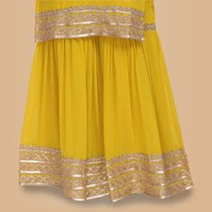 Looking for an elegant and sophisticated garara set that is perfect for any special occasion? Then look no further than our Elegant Garara Set with Gold Accent! This beautiful set features a simple garara silhouette with stunning heavy gold gota accents on the edge of the top, garara and dupatta. The yellow color is perfect for any event, day or night, and will make you stand out from the crowd. Whether you're attending a wedding, engagement party or other formal event, this garara set is sure t Ready To Wear Saree, Sari Blouse, Gold Accent, On The Edge, Saree Blouse, Exclusive Collection, Yellow Color, Engagement Party, The Edge