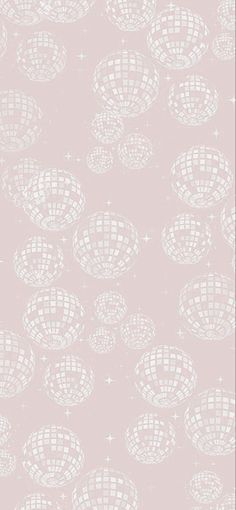 a pink wallpaper with white circles and stars on the bottom, in front of a gray background