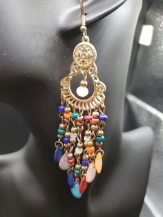 1990s multi colored chandelier earrings. In excellent vintage condition. Elegant Multicolor Beaded Dangle Earrings, Multicolor Drop Earrings For Party, Rainbow Dangle Metal Earrings, Elegant Multicolor Metal Beaded Earrings, Bohemian Chandelier Earrings With Colorful Beads, Multicolor Jewelry With Dangling Charms For Party, Multicolor Metal Clip-on Earrings, Multicolor Metal Dangle Chandelier Earrings, Multicolor Dangling Charms Jewelry For Party