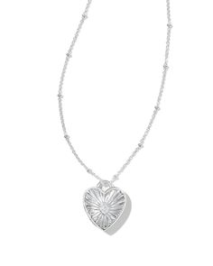 Keep your loved one close to your heart with the Meredith Sterling Silver Locket Necklace in White Topaz. Crafted with long-lasting metal and embellished with white topaz detailing, this sweet locket style is so easy to love. Subtle yet oh-so-darling, it’s one you’ll wear over and over. Metal Sterling Silver Why Sterling Silver? Our Sterling Silver collection features elevated styles to wear time and time again. With a base of both pure silver and copper, Sterling Silver provides a precious yet affordable option that offers long-lasting wear and shine and is the perfect addition to your Demi-Fine jewelry rotation. Learn More About Metals & Care Material White Topaz Closure Lobster Clasp Size 18" L Chain With A 0.71" L X 0.62" W Pendant With A 2" ExtenderDue to the one-of-a-kind nature of t Kendra Scott Butterfly Necklace Silver, Silver Necklace Locket, Simple Silver Pendant, Silver Jewelry Aesthetic Earrings, Lockets Silver, Jewelry Inspo Silver, Small Silver Necklace, Silver Necklace Heart, Locket Necklace Silver