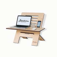 a laptop computer sitting on top of a wooden chair