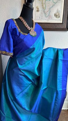 Pure Kanjivaram Hand woven Plain silk saree with Prestitched Blouse Gemstone blouse  blouse size -36 goes upto 42/44 Alterations to the blouse can be requested  video calls 408-667-0781 DETAILS AND CARE Color : Blue Weight : 600 - 800 grams Length : 5.5 m saree + 0.7 m blouse  Width : 48 Inches Fabric :kanjivaram  Craft Description : kanjivaram Wash Care : Dry Wash Only Shipping Time : 5 - 7 Working days We Ship Worldwide SHIPPING AND RETURNS Shipping Policy : Shipping days as mentioned above, subject to changes based on the government regulations around the prevailing pandemic situation.  Return Policy : No returns on the orders that have personalization such as Blouse Stitching , Fall / Pico work. We have a comprehensive returns policy , kindly refer to our policy section to know more . Blue Raw Silk Saree With Unstitched Blouse, Blue Tissue Silk Saree With Zari Weaving, Blue Art Silk Blouse With Zari Weaving, Designer Blue Paithani Silk Lehenga, Blue Handloom Tissue Silk Traditional Wear, Blue Handloom Blouse For Diwali, Blue Tissue Silk Saree With Unstitched Blouse, Blue Handloom Blouse For Puja, Blue Tissue Silk Blouse Piece With Pallu Detail