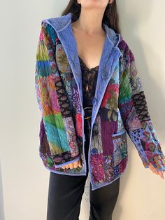 Rare find! One-of-a-kind reversible quilted jacket in a patchwork of vibrant, psychedelic prints.  The absence of tag and small imperfections suggest it was most likely handmade, probably in the 70s. The reverse has a gorgeous cornflower blue colour with subtle golden accents. Comfortable, lightweight fabric - most likely cotton. A few flaws here and there : - some missing stitches throughout  - discolouration throughout the reverse side - a missing button on the reverse (it was originally missi Multicolor Patchwork Quilted Winter Jacket, Multicolor Patchwork Quilted Jacket For Winter, Vintage Quilted Multicolor Outerwear, Spring Multicolor Floral Patchwork Outerwear, Bohemian Hooded Spring Outerwear, Bohemian Hooded Outerwear For Spring, Multicolor Patchwork Quilted Jacket For Spring, Colorful Bohemian Outerwear For Spring, Spring Vintage Quilted Jacket With Patchwork