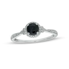 Start your endless love story with this vintage-inspired gemstone and diamond engagement ring. Fashioned in cool 10K white gold, this look showcases a 5.0mm rich black sapphire surrounded by a frame of shimmering diamonds. Trios of bezel-set diamonds in milgrain-lined frames flank the center while additional diamonds adorn the milgrain-detailed tapered shank. Radiant with 1/10 ct. t.w. of diamonds and a bright polished shine, this engagement ring reflects your unique romance. Vintage Style Engagement Rings, Diamond Frame, Black Sapphire, Bezel Set Diamond, Endless Love, Diamond Rings Bands, Sapphire Stone, Gemstone Engagement Rings, Wedding Ring Sets