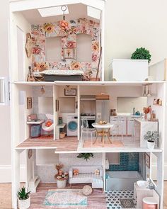 a doll house is shown with furniture and accessories