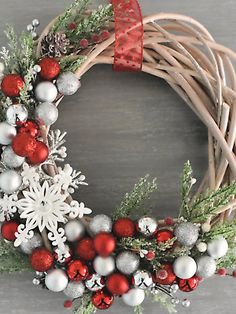 a christmas wreath with red and white ornaments