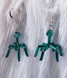 These Earrings are an artistic representation of a Virus. They are made of glass beads, teal in color. They measure 1 inch long by .75 of an inch wide. The earring posts are silver plated. (If you require stainless steel posts, please message me for details.) Very Cute and Nerdy. Available in different colors! If you would like to order multiples of this listing, message me for details. Thank you for shopping with me! Follow me on Instagram for coupon codes, new inventory, and sales! @biolojewel Science Earrings, Biology Science, Science Biology, Earring Posts, Biology, Post Earrings, Coupon Codes, Turquoise Necklace, Different Colors