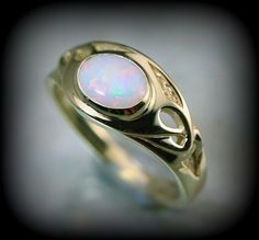 You are a big fan of art nouveau like i am, you'll love this piece ; there is elegancy and a flair of mystery with this style that makes it unique. Here is a ring i create recently to honor this style. The ring is made in solid 10 k or 14 k gold with a beautiful opal. You can order with another stone by sending me a message.  ring dimensions on the top : 10 mm band dimensions : 2 mm Because the environment means a lot to me just like you, all my jewelry is sent with the recyclable material, such as paper bags and boxes of jewels made with 100% recycled cardboxes made with 77% post-consumer fiber and 23% pre-consumer fiber. Also I use small biodegradable plastic bags. I print your invoices on ecological certified paper, earth choice 14k Gold Art Deco Jewelry, Art Deco 14k Gold Promise Ring Jewelry, 14k Gold Art Deco Promise Ring, 14k Gold Art Deco Promise Ring Jewelry, Unique 14k Gold Moonstone Ring Gift, Elegant Opal Cabochon Jewelry, Elegant Gold Opal Ring, Elegant Opal Jewelry With Cabochon, Antique Oval Opal Ring As Gift