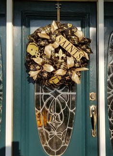 Large Hand-made Saints Wreath made with mesh. Can be picked up in Metairie,  La or shipped to you for a fee. Saints Deco Mesh Wreaths, Saints Wreaths, Saints Wreath, Door Wreath Hanger, How To Make Wreaths, Wreath, Hand Made, Mesh, Ships