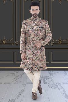 This multi-color sherwani for men is a versatile addition to any wardrobe. Crafted with precision, its unique design showcases expert tailoring and a blend of vibrant colors, making it perfect for any occasion. Express your personal style with confidence and make a statement wherever you go. Traditional Multicolor Fitted Kurta, Designer Long Multicolor Kurta, Elegant Multicolor Traditional Wear With Dabka, Elegant Multicolor Traditional Drape Kurta, Multicolor Elegant Traditional Wear With Dabka, Multicolor Unstitched Sets For Formal Occasions, Multicolor Unstitched Formal Sets, Multicolor Long Designer Kurta, Designer Long Sleeve Beige Sherwani