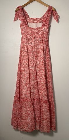 This floral maxi dress is the stuff of dreams! It is Union Made and from the 1970's, made predominantly of cotton and polyester. It's a gorgeous dress and perfect for spring and summer! It is a coral pink color with a white floral pattern on it. It is closest to a modern day size 2/4, but here are the exact measurements taken lying flat and doubled: Shoulders: 15 inches Chest: 28 inches Waist: 24 inches Hips: 30 inches Shoulders to Hem: 50 inches This dress has an inner lining too, so it keeps i Sundress With Ditsy Floral Print Maxi Length, Maxi Sundress With Ditsy Floral Print, Spring Maxi Dress With Ditsy Floral Print, Casual Coral Dress For Vacation, Maxi Sundress With Ditsy Floral Print For Vacation, Flowy Summer Maxi Dress With Ditsy Floral Print, Spring Vacation Maxi Dress With Ditsy Floral Print, Ditsy Floral Print Maxi Sundress For Summer, Summer Flowy Maxi Dress With Ditsy Floral Print