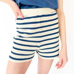 Size Large Fabric: Soft, Crochet Knit, Stripe Pattern, Cream + Dark/Navy Blue Elasticated Waistband Ribbed Hem Regular Fit 100% Cotton Re-Shape Whilst Damp Dry Flat These Shorts Are The Epitome Of Style And Comfort, With A Soft Crochet Stitch Starring In Contrasting Stripes To Allow For Playful Styling. Wear With The Lumi Mozart Crochet Vest For The Coordinating Crochet Wardrobe Moment Of The Season. Fitted Knit Shorts For Summer, Spring Crochet Fitted Shorts, Spring Fitted Crochet Shorts, Fitted Cotton Crochet Shorts, Fitted Crochet Cotton Shorts, Fitted Crochet Shorts For Spring, Crochet Wardrobe, Crochet Star Stitch, Soft Crochet