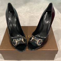 Gucci Vernice Soft Metal Black Heels- Never Worn Size 9.5 Never Worn Luxury High Heel With Horsebit Detail, Gucci Horsebit Heels For Office, Designer Formal Heels With Horsebit Detail, Luxury Black Heels With Horsebit Detail, Elegant Round Toe Heels With Horsebit Detail, Elegant Black Heels With Horsebit Detail, Gucci Designer Patent Leather Heels, Designer Gucci Patent Leather Heels, Gucci Black Heels With Horsebit Detail