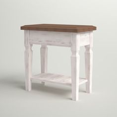 a small white table with a wooden top