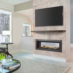 a living room with a tv mounted on the wall and a fire place in front of it