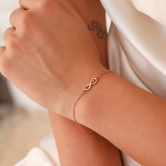 Tiny Infinity Bracelet, 14K Solid Gold Infinity Bracelet, Dainty initial Love Bracelet, Handmade Gold Anniversary Bracelet, Gift For Her, Summer Jewelry, Anniversary Bracelet, Birthday Gift, Christmas Gift, Solid Gold Bracelet, Minimalist Gold Bracelet, Wedding Bracelet, Valentine's Day Gift "Material: SOLİD GOLD (No Gold Filled Or No Gold Plated)" "KARAT: 14K (585) "Bracelet Length: 13 MM "Bracelet Width: 5 MM "Available Gold Color: (Yellow Gold, White Gold, Rose Gold) "The certificate will be Elegant Sterling Silver Name Bracelet For Friendship, Elegant Sterling Silver Friendship Name Bracelet, Elegant Infinity Jewelry For Friendship, Dainty Infinity Bracelets For Friendship, Dainty Infinity Bracelet For Friendship, Elegant Rose Gold Infinity Bracelet, Dainty Infinity Bracelets With Adjustable Chain, Dainty Infinity Bracelet With Adjustable Chain, Rose Gold Infinity Bracelets For Friendship