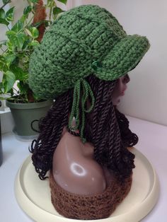 a crocheted hat on top of a mannequin head