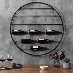 a wine rack is mounted on the wall above a table