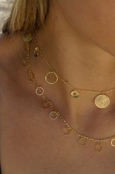 -18k gold plated delicate necklace with gold coins and circles. -Measures 16" with 2" extendor. -Handmade in Brazil . -Please note that our brand uses natural, semi-precious stones; making each piece unique in texture, shine, and color. 14k Gold-filled Necklace With Dangling Charms, 14k Gold Filled Necklace With Dangling Charms, Gold Hammered Charm Necklace, Gold Plated Hammered Coin Necklace, Dainty Gold Circle Coin Necklace, Dainty Gold Coin Necklace, Gold Coins, Delicate Necklace, Semiprecious Stones