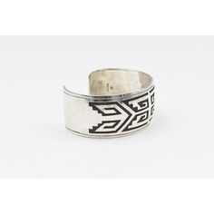 This is part of Chairish’s Costume Jewelry assortment.  Vintage Native American sterling silver  bracelet cuff handmade and designed by Jacob Kahe. The front has a polished finish and the back has a satin finish.  It is marked Sterling with Jacob Kahe's hallmark.  Interior of the cuff measures 5 1/2"with an additional 1 " gap for a total circumference of 6 1/2".  Sterling Silver is relatively malleable, thus this cuff is slightly adjustable. Width measures 2.41" straight across the widest part(from wrist bone to wrist bone). Bracelet face measures .95" tall (the face of the bracelet, north to south). Bracelet depth from top the underside of wrist is 1.86". Formal Sterling Silver Open Cuff Bracelet, Sterling Silver Open Cuff Bracelet For Formal Occasions, Classic Silver Wide Band Cuff Bracelet, Adjustable Wide Band Cuff Bracelet For Formal Occasions, Silver Wide Band Classic Cuff Bracelet, Classic Ceremonial Cuff Bangle Bracelet, Modernist Polished Cuff Bangle Bracelet, Classic Ceremonial Cuff Bracelet Styled As Bangle, Modernist Sterling Silver Bangle Gift