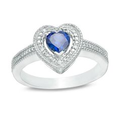 She’ll adore the thoughtful details of this vintage-inspired ring. Crafted in sterling silver, this precious design amazes with a 5.0mm heart-shaped lab-created bright blue sapphire wrapped in heart-shaped halo frame adorned with sparkling diamond accents, beaded detailing and intricate milgrain borders. The slender shank is adorned with beaded and milgrain detailing to complete this keepsake look. Buffed to a brilliant luster, this sentimental choice is destined to be cherished. Custom-made to Beaded Frame, Bead Frame, Vintage Style Rings, Peoples Jewellers, Blue Sapphire Diamond, Sparkling Diamond, Sapphire Stone, Sparkle Diamonds, Perfect Ring