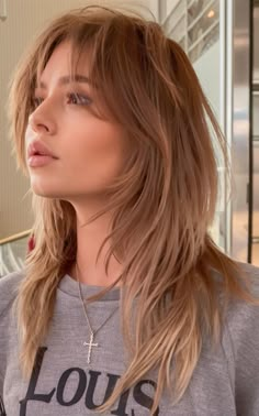 This take on the wolf cut adds a polished twist with its ash-blonde tone and soft, flowing layers. The subtle highlights brighten the face, while the expertly blended layers offer dimension and movement. It’s a chic option for wolf cut hair ideas long with a modern, refined edge. Wolf Haircut Medium Length Straight, Edgy Long Hair Color, Long Kitty Cut Hair, Blonde Wolf Cut With Bangs, Wolf Cut Long Straight Hair, Wolf Cut Long Hair Wavy, Wolf Cut Hair Color Ideas, Whimsical Haircut, Layered Wolf Cut Medium Hair