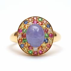 Adding some really fun affordable items to the shop for a quick pick-me-up or holiday present. This piece is super colorful with a lovely purple hazy tanzanite cabochon surrounded by a rainbow of tourmalines. Ring face measures approx. 15m x 14mm. Ring size 7.25. Setting is gold vermeil (gold over sterling silver). Multicolor Cabochon Gemstones Fine Jewelry, Multicolor Cabochon Gemstones For Fine Jewelry, Fine Jewelry Multicolor Cabochon Gemstones, Fine Jewelry Multi-stone Cabochons As Gift, Multicolor Cabochon Rings Fine Jewelry, Multicolor Cabochon Rings In Fine Jewelry Style, Multicolor Oval Sapphire Ring, Multicolor Sapphire Ring, Yellow Gold Multi-stone Cabochons For Gift