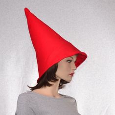 Red gnome hat with an extra wide brim. You wear this further back on your head to accommodate the extra girth of the brim. Tall and pointed made from soft fleece. Fits heads 22.5 and up. Upper portion of the hat is lined with interfacing so the hat stands tall. The bottom edge of this hat measures about 29 inches around, it is intended to be loose and flair out. Made and ready to ship, MG001464 Click here for the complete collection of holiday hats and caps. https://www.etsy.com/shop/MountainGot Red Halloween Hat One Size Fits Most, Red Brimmed Costume Hat One Size, Red Costume Hat, Red Brimmed Hat For Costume, Hats And Caps, Gnome Hat, Holiday Hats, Hat Stands, Fantasy Costumes