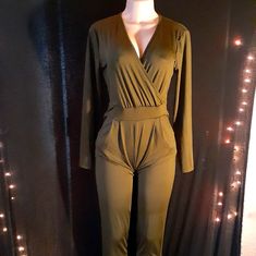 Classic And Cool Dark Green Long Sleeve V Cut Front Sexy Back Out Detail Very Comfortable 32 Inch Inseam Great Stretch Stretch Knit That Is Medium Weight Will Fit A Large-Xtra Large Easy To Accessorize Great Go To Piece For Any Wardrobe New With Tag Casual Long Sleeve Club Jumpsuits And Rompers, Casual Long-sleeved Jumpsuits And Rompers For Club, Green V-neck Jumpsuits For Night Out, Casual Long Sleeve Bodysuit For Date Night, Stretch V-neck Bodysuit For Going Out, Green V-neck Jumpsuits And Rompers For Night Out, V-neck Jumpsuits And Rompers For Going Out In Fall, Chic Green Bodysuit For Night Out, Stretch Jumpsuits And Rompers For Date Night In Fall