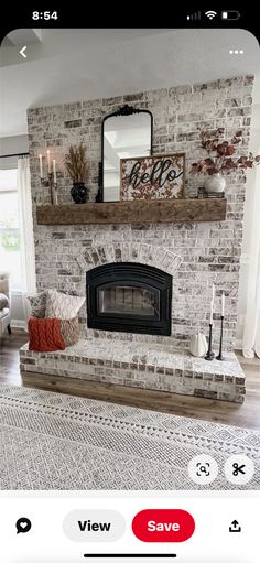 a living room with a fire place in the center and a mirror on the wall above it